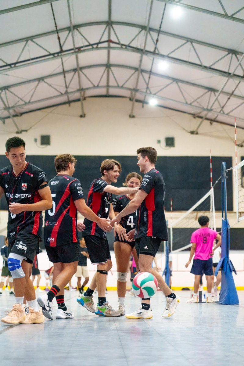 Team celebrating together at mid-court